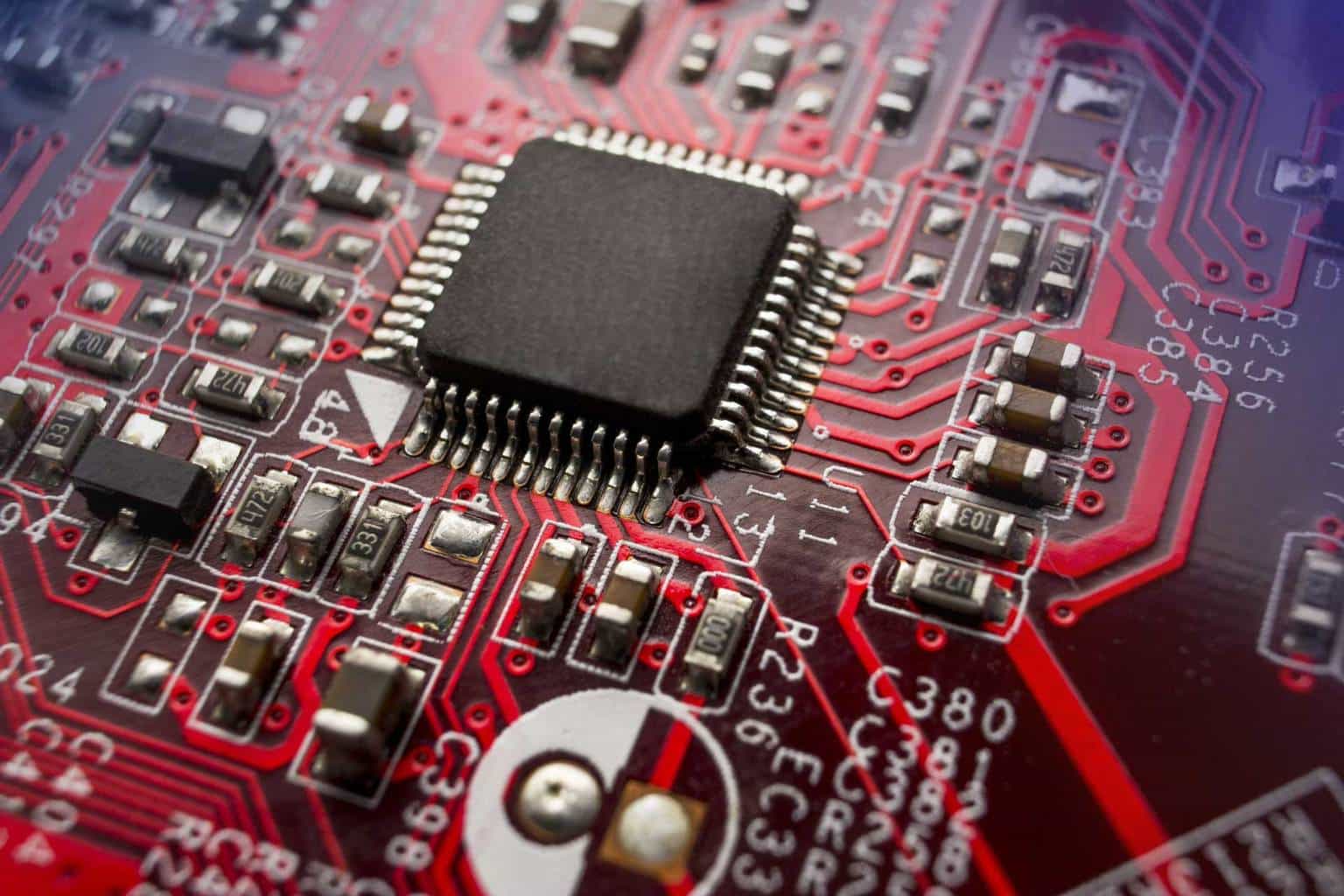A close image of a red computer mother board